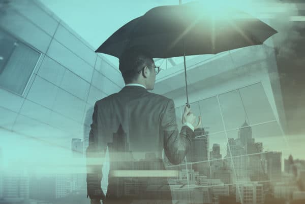 Business man holding an umbrella