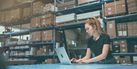 warehouse worker on a laptop