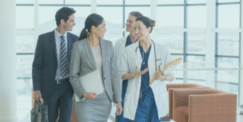 doctor and group with clipboard