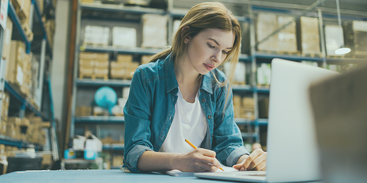 Business owner exploring specialty finance for her supply chain in her warehouse.