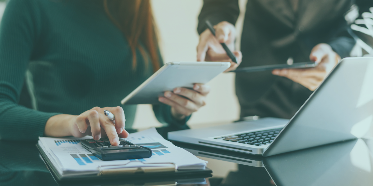 Business owners working through late payments