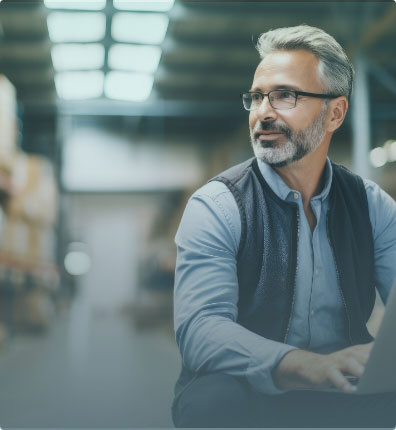 Manufacturing business owner smiling.