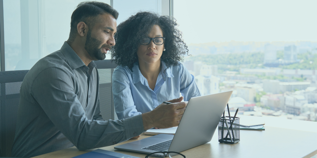 A couple looking at cash flow financing on their laptop.