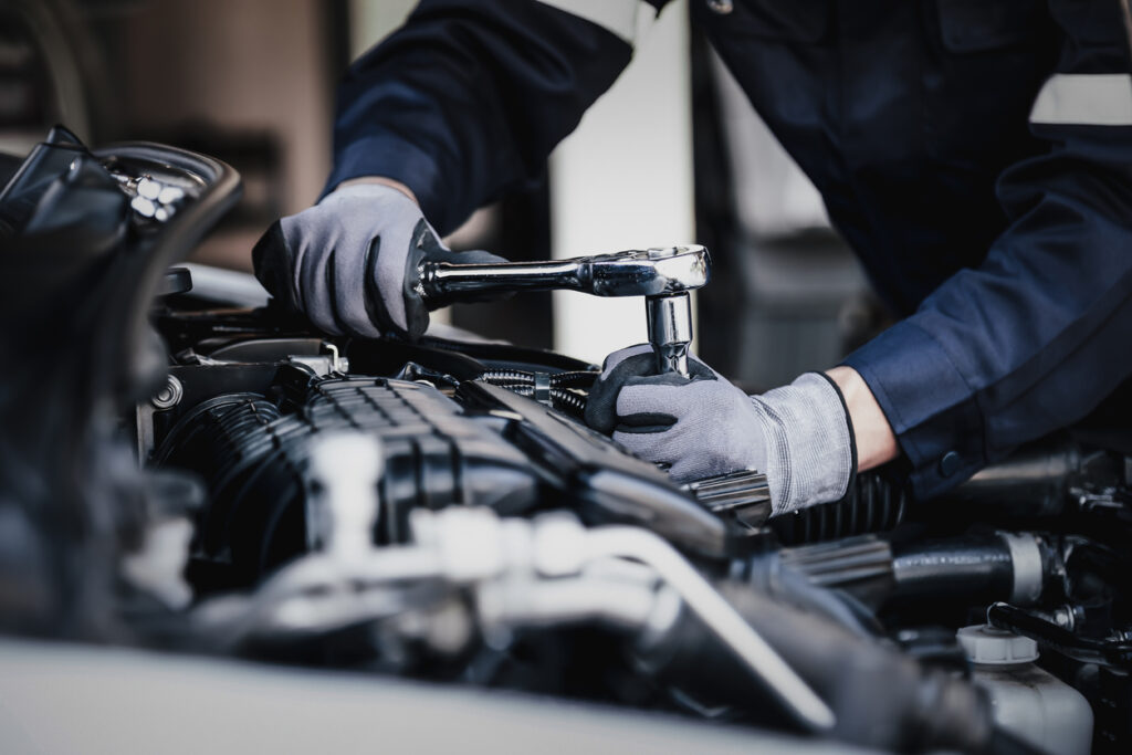 Mechanic working on an engine.