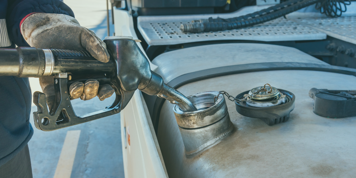 Transport truck owner operator fueling up his truck.