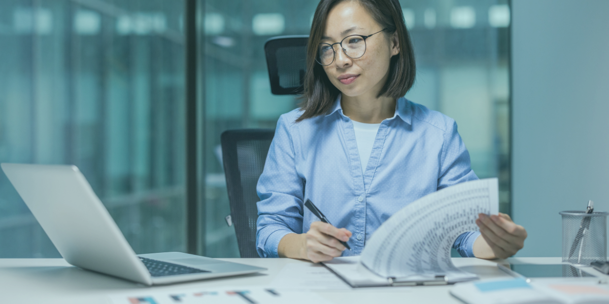 Concerned accountant reviewing financial statements.