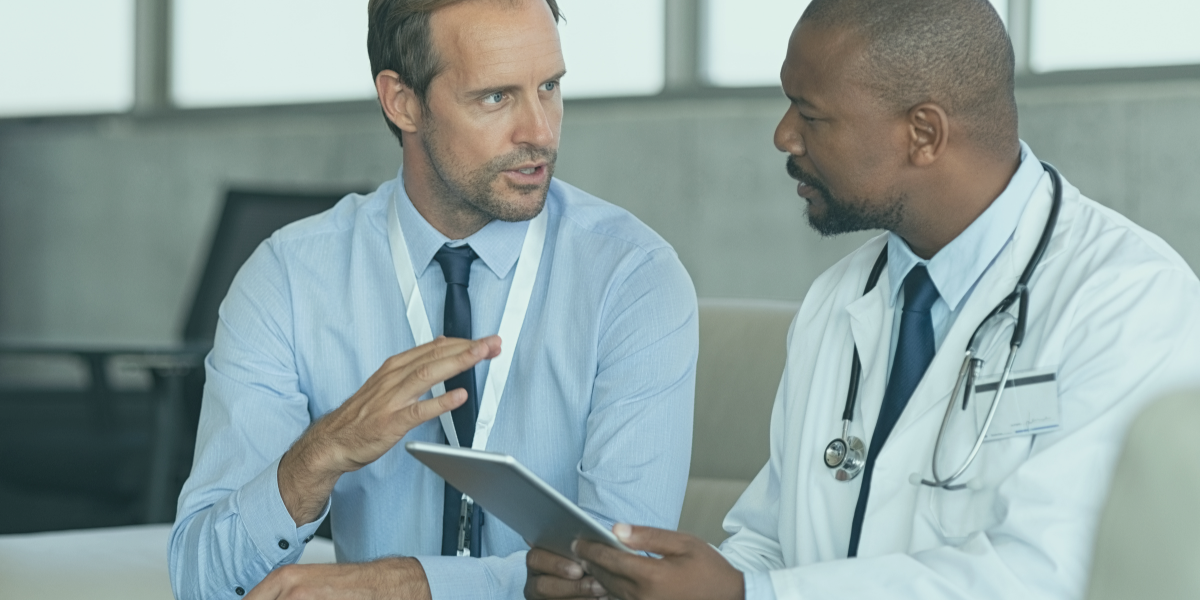 Healthcare professionals discussing early payment program options.