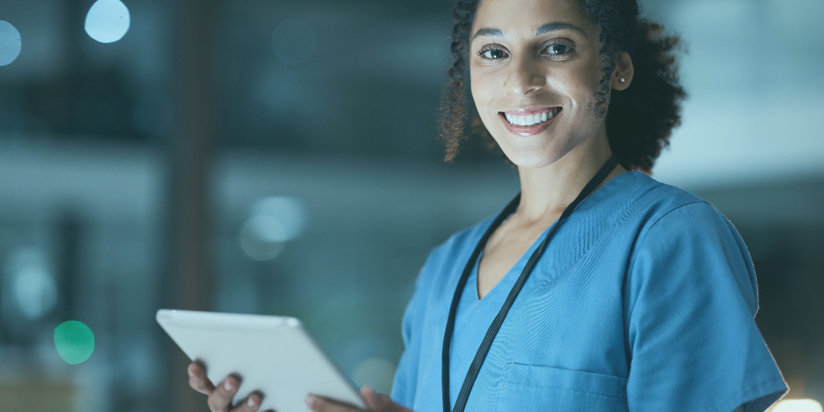 Healthcare professional reviewing patient information on a tablet, representing healthcare financing and accounts receivable financing solutions.