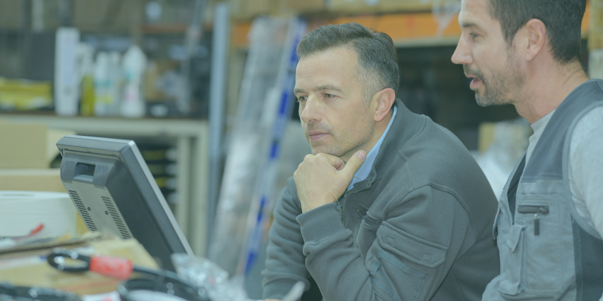 Business professionals reviewing supplier adoption in a supply chain finance program